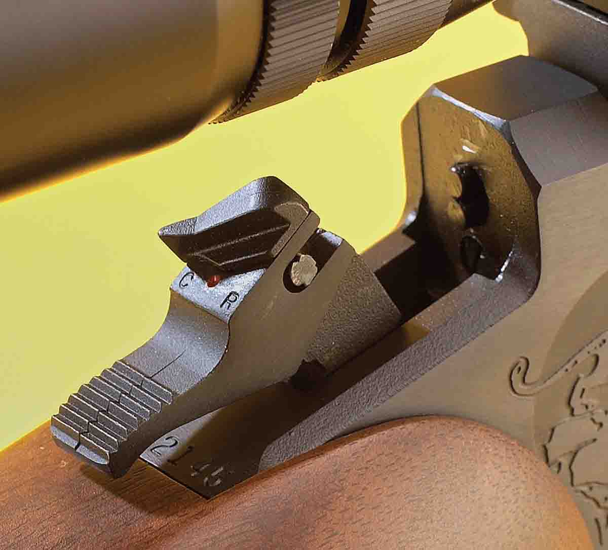The hammer on the Contender is made to fire both rimfire and centerfire barrels. Note the dual firing pins just forward of the hammer.